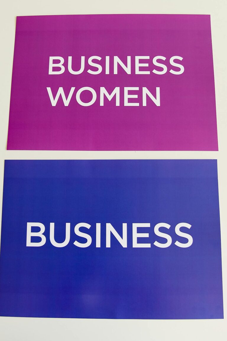 Colorful business and women empowerment signs in purple and blue, ideal for corporate themes.